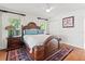 Comfortable main bedroom featuring a beautiful rug, hardwood floors, and serene lighting at 6315 Marbella Blvd, Apollo Beach, FL 33572