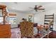 Office space features hardwood floors, a Persian rug, antique furniture, and large sunlit windows at 6315 Marbella Blvd, Apollo Beach, FL 33572