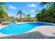Relax in the refreshing pool and spa, surrounded by tropical landscaping and a secure fence at 6315 Marbella Blvd, Apollo Beach, FL 33572