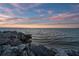 Picturesque ocean view with a rocky shoreline, perfect for a waterfront property at 6315 Marbella Blvd, Apollo Beach, FL 33572