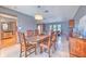 Open concept dining room bathed in natural light offers an easy flow into other rooms at 6709 W Knights Griffin Rd, Plant City, FL 33565