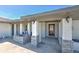 Inviting covered front porch with stone accents and custom lighting welcomes you to this charming home at 6709 W Knights Griffin Rd, Plant City, FL 33565