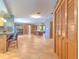 Open concept living space features wood flooring, natural light, and neutral paint at 6709 W Knights Griffin Rd, Plant City, FL 33565