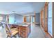 Spacious home office featuring hardwood floors, built-in bookshelves, and lots of natural light at 6709 W Knights Griffin Rd, Plant City, FL 33565