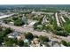 An aerial view captures the neighborhood's proximity to the highway, a nearby pond, and a mix of residential buildings at 7307 Summerbridge Dr, Tampa, FL 33634