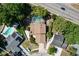 Birds eye view of home featuring fenced yard, screened-in pool, and landscaping at 7307 Summerbridge Dr, Tampa, FL 33634