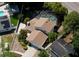 Aerial view of home featuring fenced yard and screened-in pool at 7307 Summerbridge Dr, Tampa, FL 33634