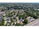 Aerial view of the neighborhood with mature trees, residential homes, and convenient access to a major roadway at 7307 Summerbridge Dr, Tampa, FL 33634