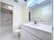 Bright bathroom features a shower-tub combo and a white single sink vanity at 7307 Summerbridge Dr, Tampa, FL 33634