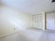 Cozy bedroom features neutral carpet and a closet with bifold doors at 7307 Summerbridge Dr, Tampa, FL 33634
