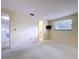 Large bedroom with a window and TV, attached to the bathroom at 7307 Summerbridge Dr, Tampa, FL 33634