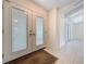 Bright foyer with tile flooring, double glass doors, and views into the home's open layout at 7307 Summerbridge Dr, Tampa, FL 33634