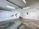 Clean garage features built-in shelving, cabinets, storage options, and durable flooring at 7307 Summerbridge Dr, Tampa, FL 33634