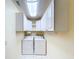 Bright laundry area with storage cabinets and tile flooring at 7307 Summerbridge Dr, Tampa, FL 33634