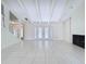 Expansive living room with high ceilings, fireplace, and tile floors, offering a bright and airy space at 7307 Summerbridge Dr, Tampa, FL 33634