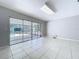 Sun-filled room with tile flooring offers direct access to the screened-in pool at 7307 Summerbridge Dr, Tampa, FL 33634