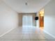 Bright living room featuring tile floors, sliding glass doors, and neutral walls at 7307 Summerbridge Dr, Tampa, FL 33634