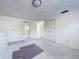 Bright loft space with neutral carpet, closet, and doorways to other rooms at 7307 Summerbridge Dr, Tampa, FL 33634