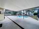 Private pool area with covered patio and lush landscaping at 7307 Summerbridge Dr, Tampa, FL 33634