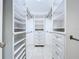 Custom walk-in closet featuring adjustable shelving and built in drawers at 7307 Summerbridge Dr, Tampa, FL 33634
