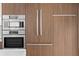Modern kitchen appliances: stainless steel oven, microwave, and built-in refrigerator at 777 3Rd N Ave # 1408, St Petersburg, FL 33701