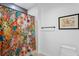 A stylish bathroom with a colorful shower curtain and modern fixtures at 777 3Rd N Ave # 1408, St Petersburg, FL 33701