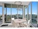 Elegant dining area with city views, stylish lighting, and a round table at 777 3Rd N Ave # 1408, St Petersburg, FL 33701