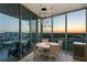 Dining room with luxury chandelier has floor to ceiling windows that offer city views at 777 3Rd N Ave # 1408, St Petersburg, FL 33701