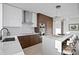 Modern kitchen with sleek cabinetry, stainless steel appliances, and a center island at 777 3Rd N Ave # 1408, St Petersburg, FL 33701