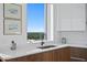 Modern kitchen sink area featuring a scenic view from the window over the counter at 777 3Rd N Ave # 1408, St Petersburg, FL 33701