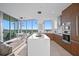 Modern kitchen with island, stainless steel appliances, and floor-to-ceiling windows at 777 3Rd N Ave # 1408, St Petersburg, FL 33701