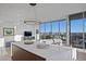 Stylish open-concept living space with city views, hardwood floors, and a modern kitchen at 777 3Rd N Ave # 1408, St Petersburg, FL 33701