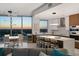 Open floor plan connects living area, kitchen, and dining area with spectacular sunset views at 777 3Rd N Ave # 1408, St Petersburg, FL 33701