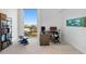 Modern office space with a large window offering expansive city views, desk, and bookshelf at 777 3Rd N Ave # 1408, St Petersburg, FL 33701