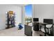 Bright office space with a desk, bookshelf, and city views through a large window at 777 3Rd N Ave # 1408, St Petersburg, FL 33701