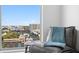 Relaxing seating area by a large window offering expansive city views at 777 3Rd N Ave # 1408, St Petersburg, FL 33701