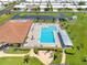 Beautiful community pool area with ample seating, lush landscaping, and convenient parking at 9110 34 N Way, Pinellas Park, FL 33782