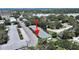 Charming condo building surrounded by lush greenery with parking, providing a peaceful community atmosphere at 100 Glennes Ln # 108, Dunedin, FL 34698