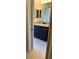 Modern bathroom featuring granite countertops, a large mirror, and stylish fixtures at 10200 Gandy N Blvd # 1133, St Petersburg, FL 33702