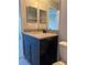 Bathroom featuring a granite countertop, vanity and mirror, for a modern aesthetic at 10200 Gandy N Blvd # 1133, St Petersburg, FL 33702