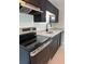Contemporary kitchen featuring stainless steel appliances, granite counters, and ample storage at 10200 Gandy N Blvd # 1133, St Petersburg, FL 33702