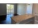 Stylish living room with a kitchen island and sliding doors to a balcony, perfect for relaxing at 10200 Gandy N Blvd # 1133, St Petersburg, FL 33702