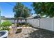 Backyard showcases a gazebo with outdoor seating, bordered by a white fence for privacy and security at 1046 Yale N St, St Petersburg, FL 33713