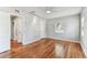 Bright bedroom featuring hardwood floors, neutral walls, and a ceiling fan for added comfort at 1046 Yale N St, St Petersburg, FL 33713