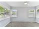 Bright bedroom featuring three large windows that provide great natural lighting at 1046 Yale N St, St Petersburg, FL 33713