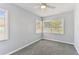 Well-lit bedroom featuring a corner window with natural light and grey walls at 1046 Yale N St, St Petersburg, FL 33713