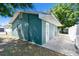 Exterior shot of a house with backyard patio area and mature trees at 1046 Yale N St, St Petersburg, FL 33713