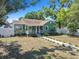 Charming home with covered porch, white picket fence and landscaping at 1046 Yale N St, St Petersburg, FL 33713