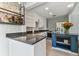 Bright kitchen featuring a blue island with seating and stainless steel appliances at 1046 Yale N St, St Petersburg, FL 33713