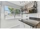 Bright kitchen featuring countertops, stainless steel appliances, and wine rack at 1046 Yale N St, St Petersburg, FL 33713